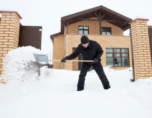 Man snow shoveling - snow removal idaho falls