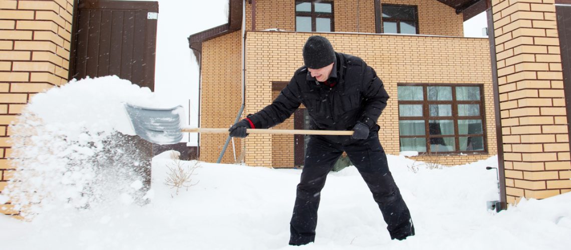 Man snow shoveling - snow removal idaho falls