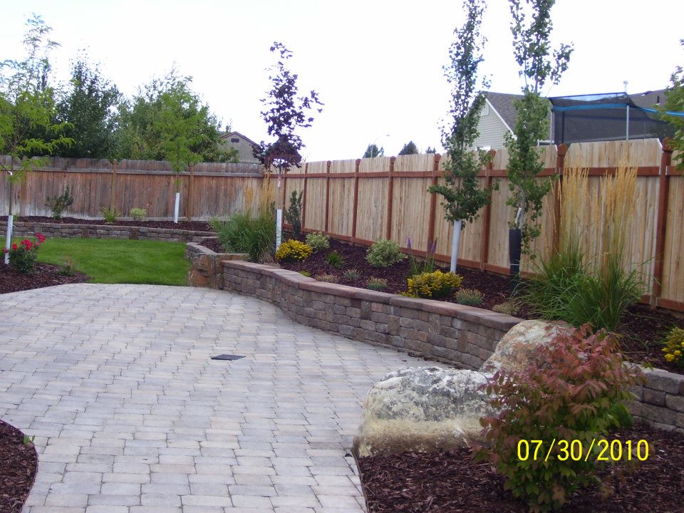 Backyard With Wooden Fence - landscaping construction idaho falls